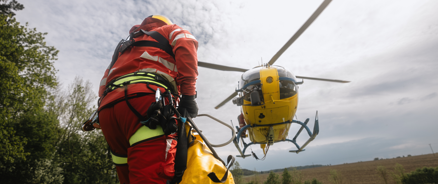 Paramedic running to helicopter of emergency medical service