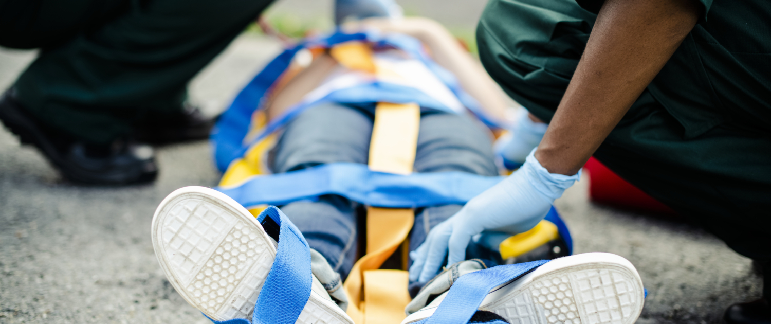 Paramedic team rescuing a young critical patient